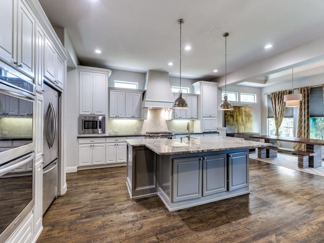 4400 Bristleleaf Ln, Prosper, TX 75078 - kitchen featuring stainless steel appliances, backsplash, custom range hood, white cabinetry, and recessed lighting