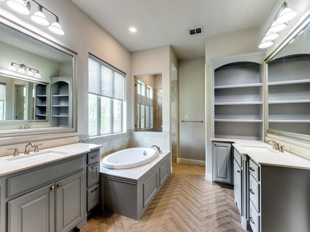 4400 Bristleleaf Ln, Prosper, TX 75078 - full bath featuring two vanities, a garden tub, recessed lighting, and baseboards