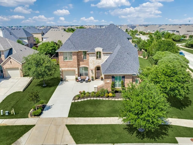 4400 Bristleleaf Ln, Prosper, TX 75078 - french country inspired facade featuring concrete driveway, brick siding, a residential view, a front lawn, and roof with shingles