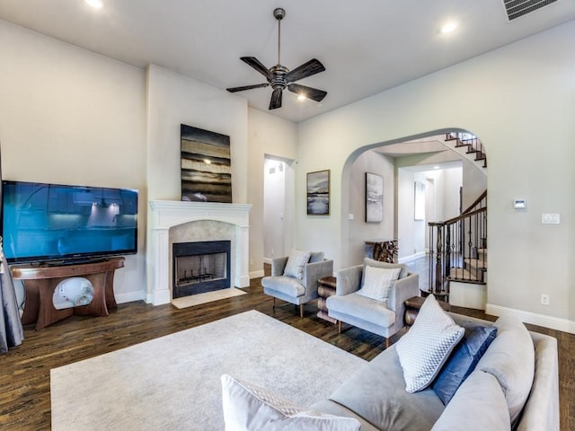 4400 Bristleleaf Ln, Prosper, TX 75078 - living room with wood finished floors, ceiling fan, stairs, baseboards, and a fireplace with flush hearth