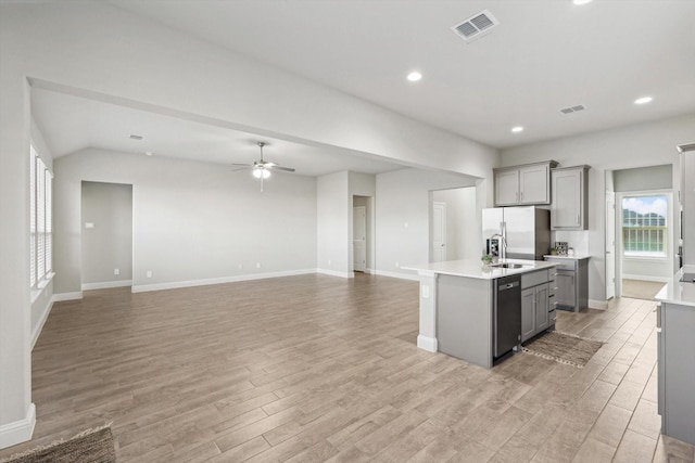 kitchen featuring gray cabinets, appliances with stainless steel finishes, light wood-style floors, and recessed lighting