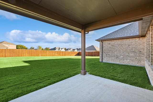 view of yard with a patio and a residential view