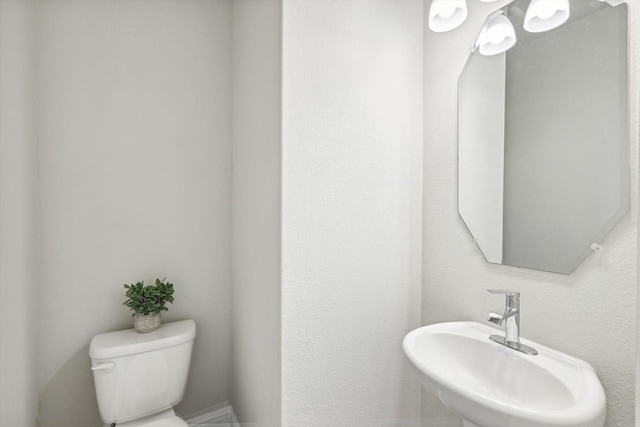 bathroom with a sink and toilet