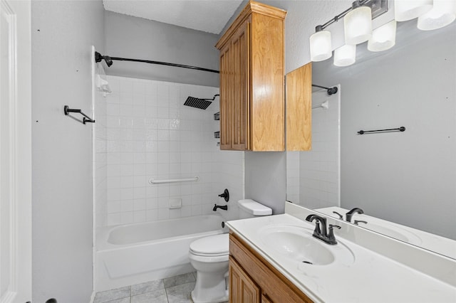 full bathroom featuring toilet, tile patterned floors, washtub / shower combination, and vanity