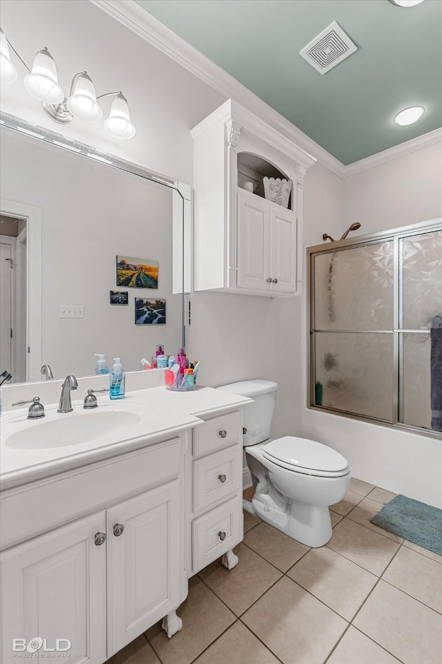 309 Slate Cir, Haughton, LA 71037 - bathroom with crown molding, tile patterned floors, toilet, vanity, and combined bath / shower with glass door