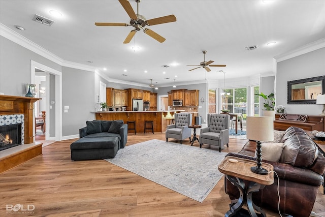 309 Slate Cir, Haughton, LA 71037 - living room with a ceiling fan, light wood-style flooring, recessed lighting, ornamental molding, and baseboards