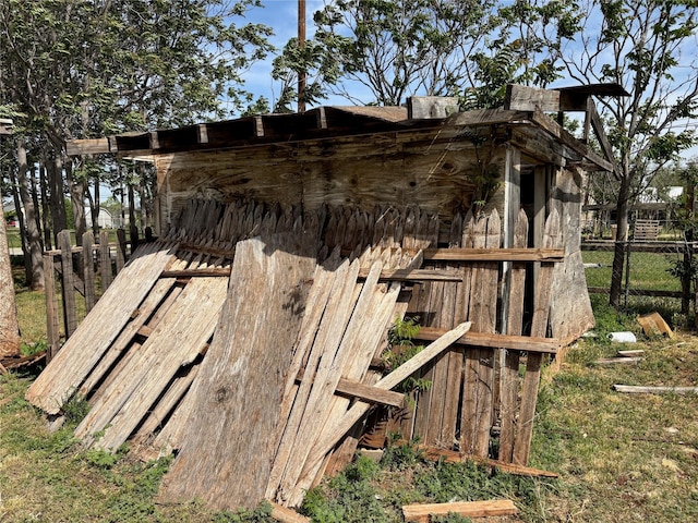 view of outbuilding with fence