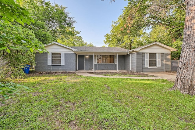 7805 Whitney Dr, White Settlement, TX 76108 - single story home with a front yard, brick siding, and a porch