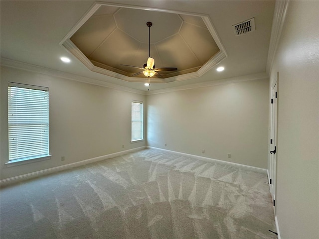 723 Dumaine Dr, Bossier City, LA 71111 - empty room featuring a tray ceiling, ceiling fan, light carpet, baseboards, and ornamental molding
