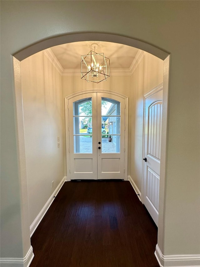 723 Dumaine Dr, Bossier City, LA 71111 - foyer with arched walkways, crown molding, dark wood-type flooring, a chandelier, and baseboards
