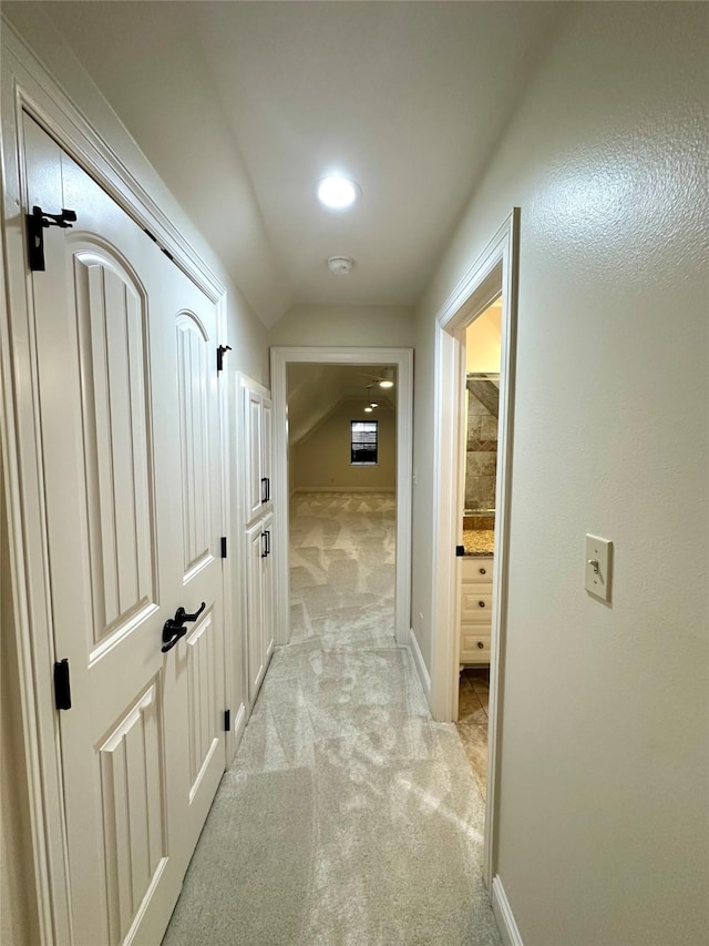 723 Dumaine Dr, Bossier City, LA 71111 - hall featuring lofted ceiling, light carpet, and baseboards