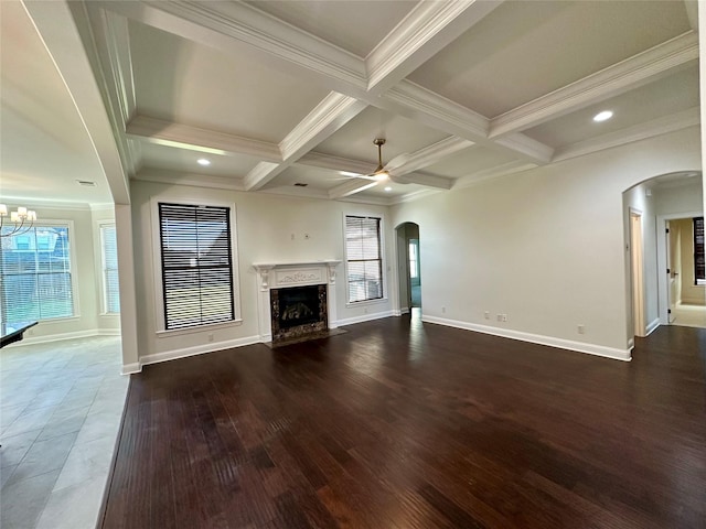 723 Dumaine Dr, Bossier City, LA 71111 - unfurnished living room with arched walkways, a fireplace, a ceiling fan, beamed ceiling, and baseboards