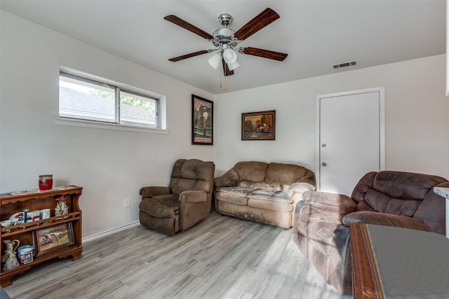 1859 Greendale Dr, Dallas, TX 75217 - living room with a ceiling fan, light wood-type flooring, and baseboards