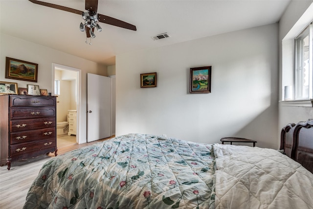 1859 Greendale Dr, Dallas, TX 75217 - bedroom with light wood-style floors, ensuite bath, and ceiling fan