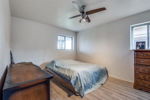 1859 Greendale Dr, Dallas, TX 75217 - bedroom with light wood-style flooring, baseboards, and a ceiling fan