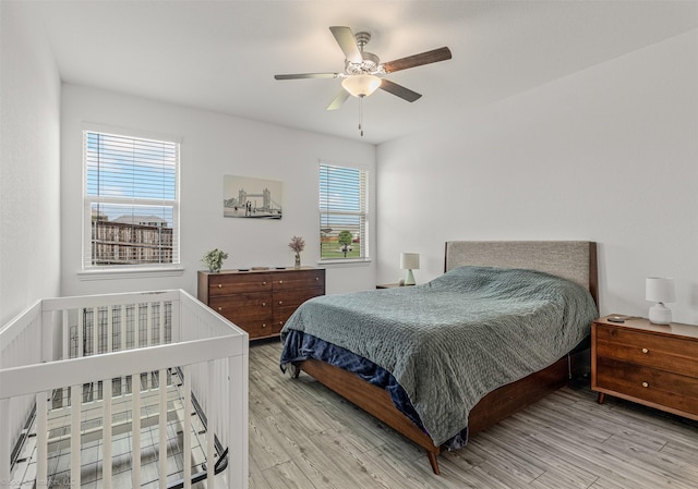 bedroom featuring wood finished floors and ceiling fan