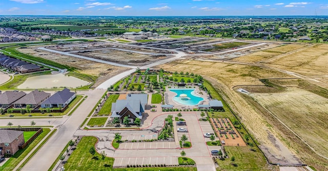 bird's eye view of a pool area and a nearby body of water