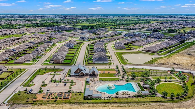 aerial view of residential area featuring a pool area