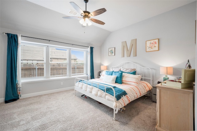 carpeted bedroom featuring lofted ceiling, baseboards, and ceiling fan