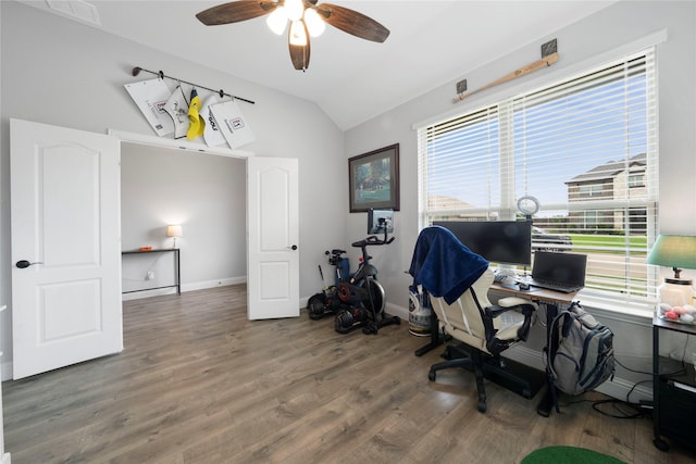 home office with vaulted ceiling, a ceiling fan, wood finished floors, and baseboards