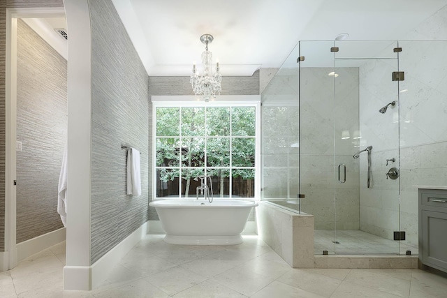 3205 Caruth Blvd, University Park, TX 75225 - bathroom with a stall shower, a freestanding bath, a chandelier, tile patterned flooring, and baseboards
