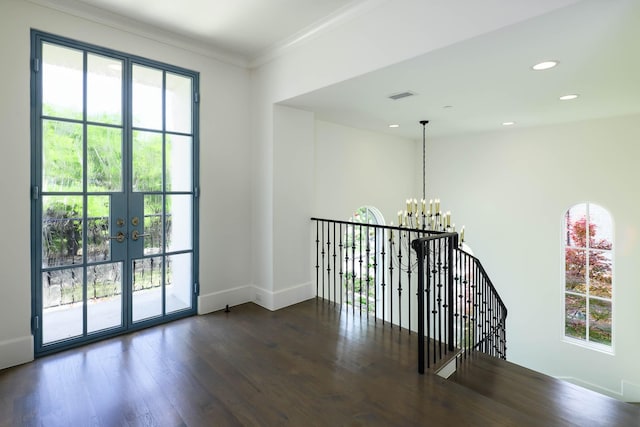 3205 Caruth Blvd, University Park, TX 75225 - corridor featuring a chandelier, wood finished floors, an upstairs landing, baseboards, and crown molding