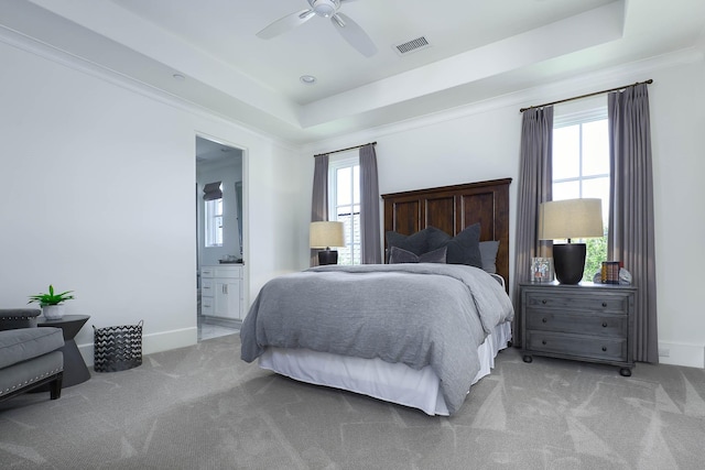 3205 Caruth Blvd, University Park, TX 75225 - bedroom with a tray ceiling, carpet floors, baseboards, ensuite bathroom, and a ceiling fan