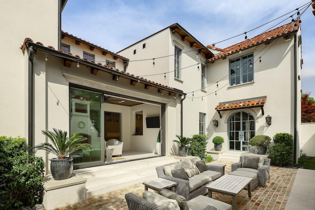 3205 Caruth Blvd, University Park, TX 75225 - back of property with stucco siding, a tiled roof, a patio area, outdoor lounge area, and french doors