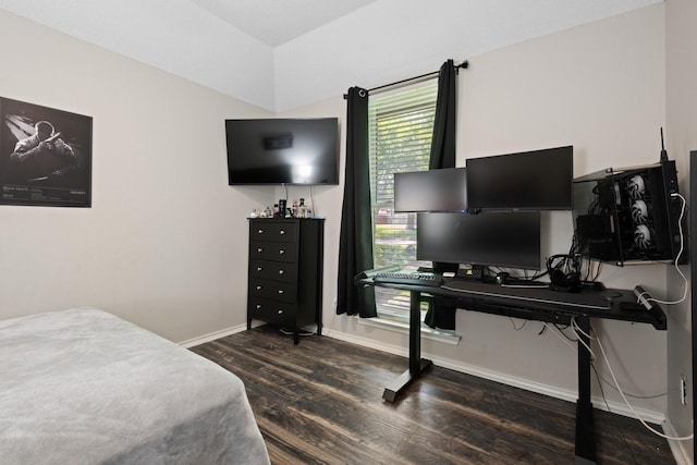 bedroom with dark wood finished floors, baseboards, lofted ceiling, and a desk