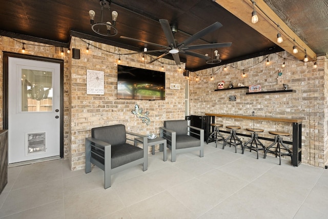 view of patio / terrace with ceiling fan and exterior bar