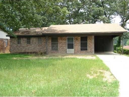 6334 Alameda, Shreveport, LA 71119 - ranch-style house with concrete driveway, an attached carport, and a front yard