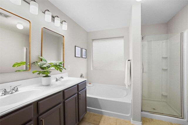 3513 San Lucas Ln, Denton, TX 76208 - full bathroom featuring a stall shower, a garden tub, double vanity, and tile patterned floors