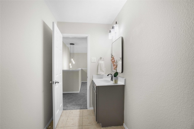 3513 San Lucas Ln, Denton, TX 76208 - bathroom with vanity, tile patterned floors, a textured wall, and baseboards