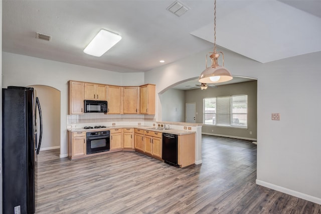 10310 Saint Georges Dr, Rowlett, TX 75089 - kitchen featuring black appliances, arched walkways, a peninsula, light brown cabinetry, and ceiling fan