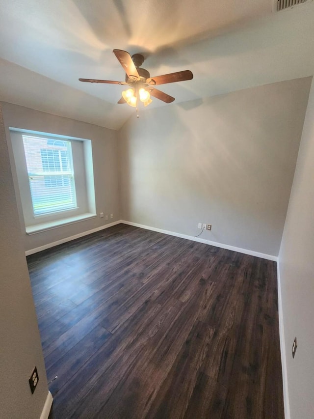 10310 Saint Georges Dr, Rowlett, TX 75089 - spare room with a ceiling fan, dark wood-style floors, and lofted ceiling
