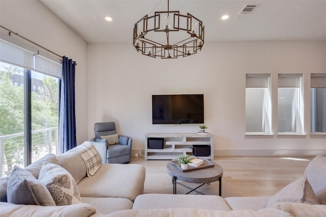 7704 Highcroft Way, Plano, TX 75024 - living room with a chandelier, baseboards, recessed lighting, and wood finished floors