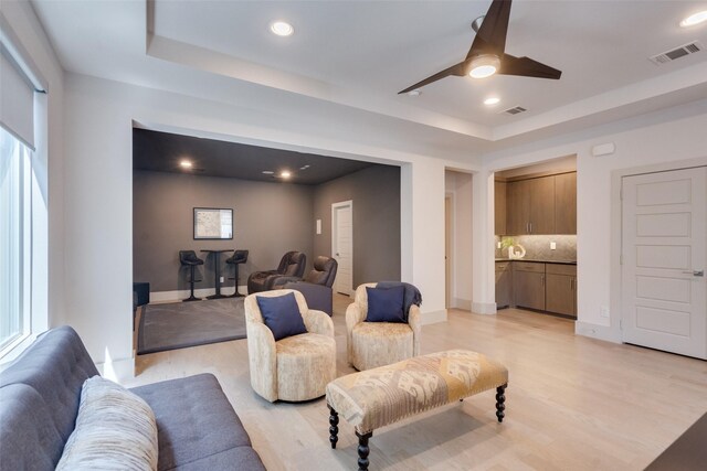 7704 Highcroft Way, Plano, TX 75024 - living room featuring a raised ceiling, ceiling fan, light wood-style flooring, baseboards, and recessed lighting