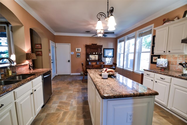 321 Fairway Meadows Dr, Garland, TX 75044 - kitchen featuring a sink, dishwasher, arched walkways, stone finish floors, and tasteful backsplash