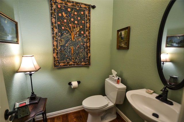 321 Fairway Meadows Dr, Garland, TX 75044 - half bathroom with a sink and wood finished floors