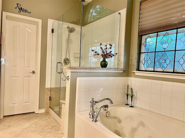321 Fairway Meadows Dr, Garland, TX 75044 - bathroom featuring a bath, a stall shower, and tile patterned flooring