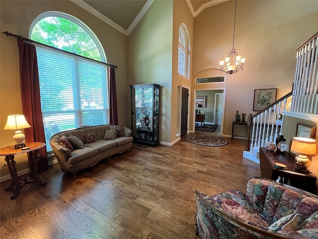 321 Fairway Meadows Dr, Garland, TX 75044 - living area with healthy amount of natural light, a chandelier, stairs, wood finished floors, and crown molding