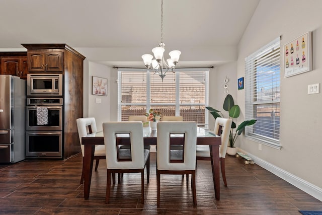 2444 Kingsgate Dr, Little Elm, TX 75068 - dining area featuring a chandelier, baseboards, and dark wood finished floors