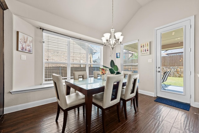 2444 Kingsgate Dr, Little Elm, TX 75068 - dining space featuring a chandelier, vaulted ceiling, dark wood finished floors, and baseboards