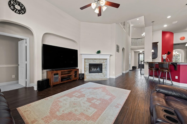 2444 Kingsgate Dr, Little Elm, TX 75068 - living area featuring ceiling fan, baseboards, a fireplace, dark wood finished floors, and recessed lighting
