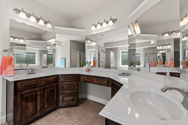 2444 Kingsgate Dr, Little Elm, TX 75068 - bathroom with tile patterned flooring, a shower stall, and double vanity