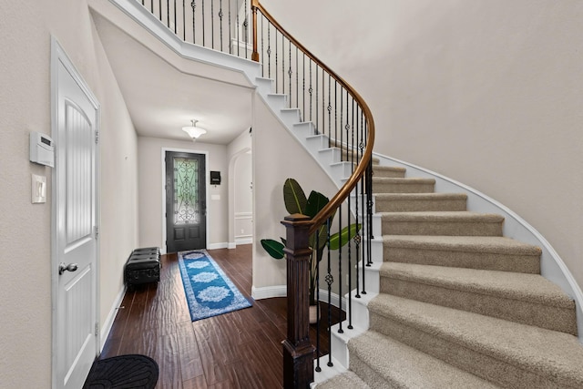 2444 Kingsgate Dr, Little Elm, TX 75068 - entrance foyer featuring wood finished floors, stairway, baseboards, and a towering ceiling