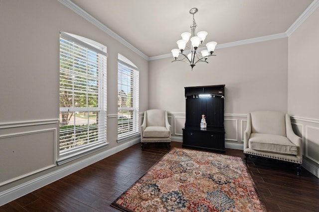 2444 Kingsgate Dr, Little Elm, TX 75068 - living area with a chandelier, ornamental molding, wood finished floors, and a wainscoted wall