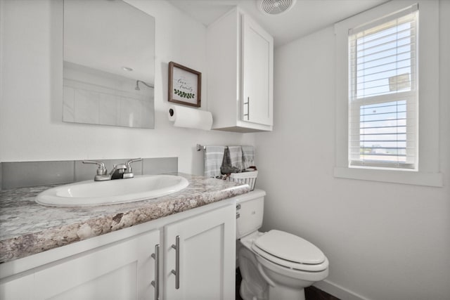 6444 Peninsula Rd, Kerens, TX 75144 - bathroom featuring plenty of natural light, toilet, and vanity