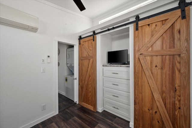 6444 Peninsula Rd, Kerens, TX 75144 - unfurnished bedroom with a barn door, a wall mounted air conditioner, dark wood finished floors, and baseboards