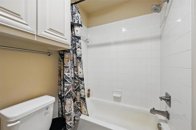 bathroom with shower / bath combo with shower curtain and toilet
